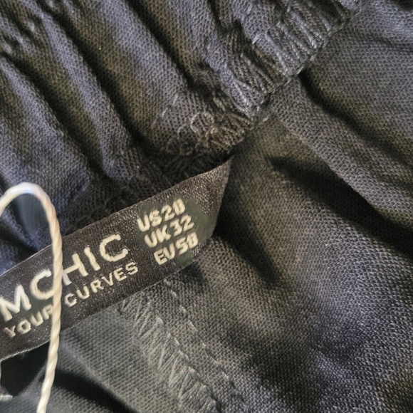 BloomChic size 28 wide leg laser cutout on legs. Black. NWT. Elastic waist - Picture 6 of 12